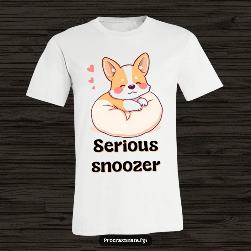 Funny happy corgi curled up on a plush pillow, dreaming, featured on a soft, comfortable t-shirt.