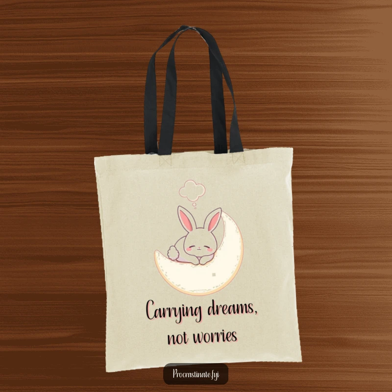Funny bunny tote bag with a smiling bunny sleeping on a soft moon, a dream bubble completing the celestial, whimsical scene.