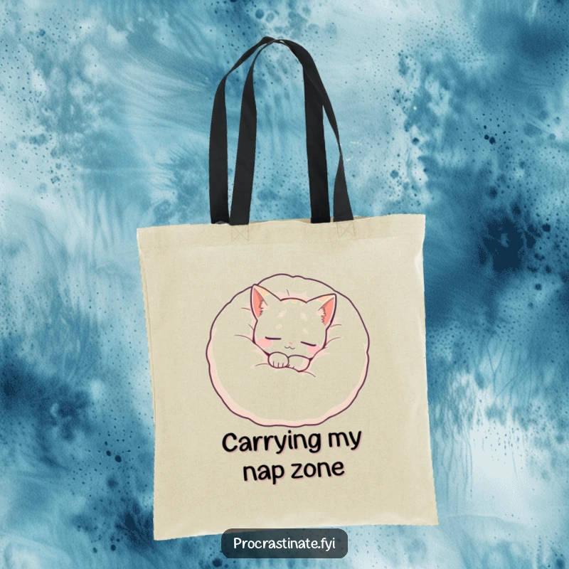 Funny cat tote bag showcasing a peaceful cat nestled in a large, fluffy pillow, perfect for carrying items with a touch of serenity.