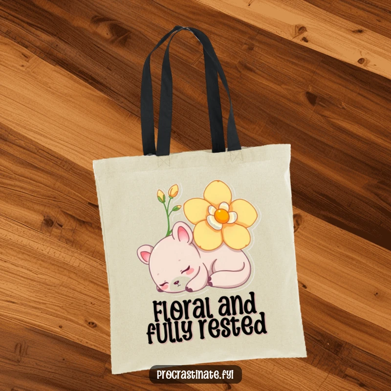 Funny Tote Bag showcasing a lazy animal character napping peacefully under a blooming flower, a serene and practical accessory.