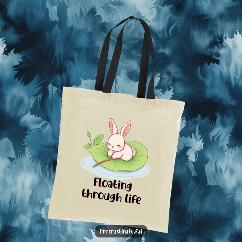 Funny rabbit tote bag with a languid rabbit floating on a giant leaf in a calm pool, a stylish and humorous accessory.